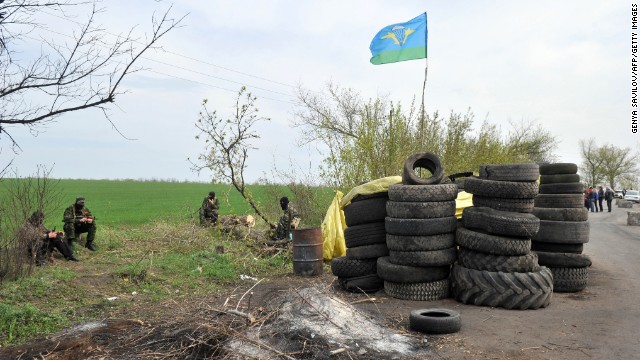 Armed pro-Russian militants stand guard at a roadblock near Slavyansk on April 20. 