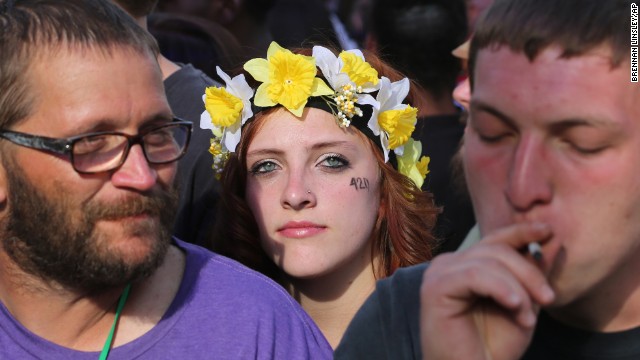 Partygoers listen to live music and smoke pot at Denver's 420 Rally on April 20. 