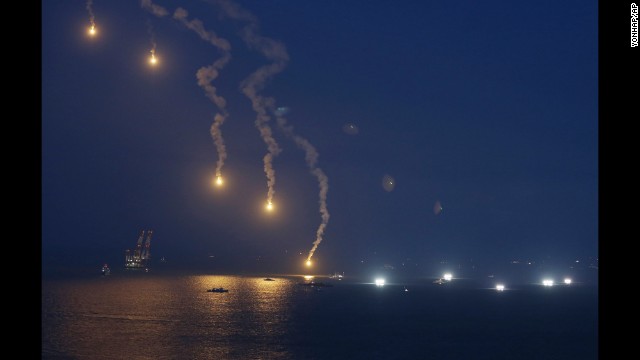 Search operations continue as flares illuminate the scene near Jindo on Sunday, April 20.