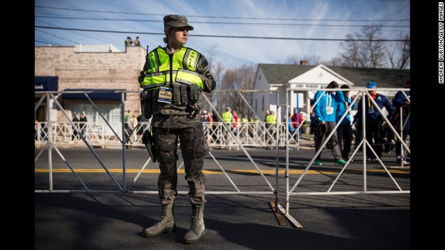 A military police officer stands guard near the starting line of the Boston Marathon in Hopkinton on April 21.