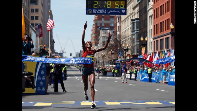 Rita Jeptoo of Kenya breaks the tape to win the women's division of the Boston Marathon in downtown Boston on Monday, April 21.