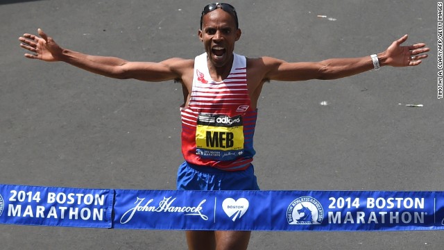 Meb Keflezighi of the United States crosses the finish line to win the men's division of the Boston Marathon in downtown Boston on Monday, April 21.