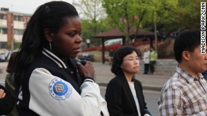 Judith Ambe grieves for friends missing after the Sewol incident at Danwon High School in Ansan, South Korea. 