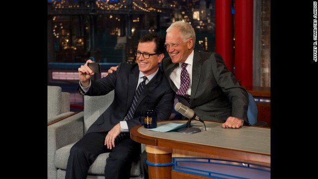 Colbert <a href='http://www.cnn.com/2014/04/23/showbiz/stephen-colbert-david-letterman-appearance/index.html?hpt=hp_c3'>takes a selfie </a>with Letterman on the "Late Show with David Letterman" on Tuesday, April 22. CBS began to introduce the next host of the "Late Show" by having its current host interview him.