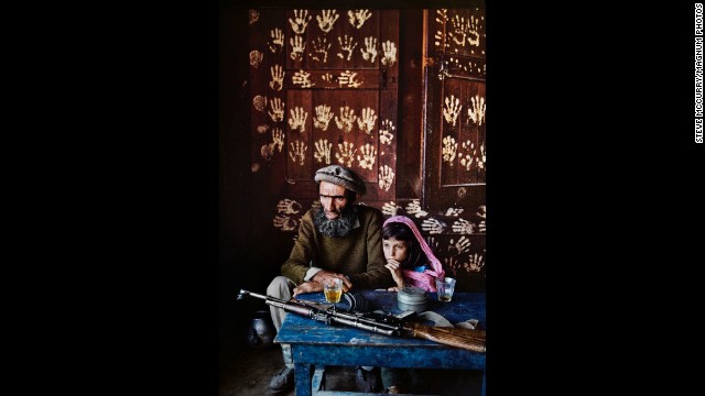 A father and daughter at home in Kamdesh, 1992.