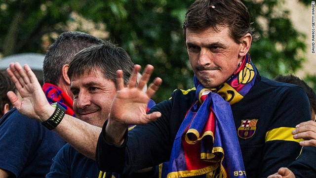Vilanova and his assistant Jordi Roura celebrate as Barcelona win La Liga with a total of 100 points - the highest total in the club's history.