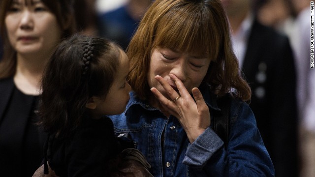 People attend a memorial for the victims of the sunken ferry on April 26.