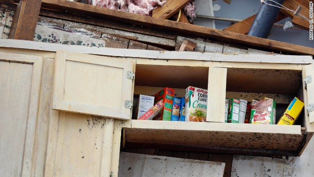 A kitchen shelf stands in what remains of a home in Louisville on April 29.