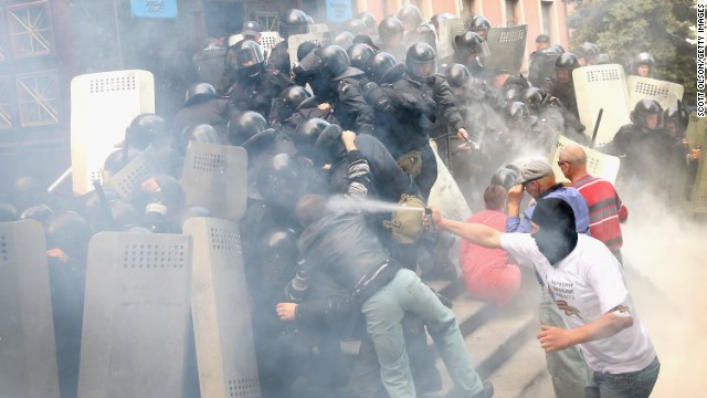 Pro-Russian activists storm the prosecutor's office in Donetsk on May 1. Police fired tear gas and stun grenades in an effort to disperse the activists.