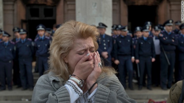 A woman cries in front of the burned trade union building in Odessa on May 3.