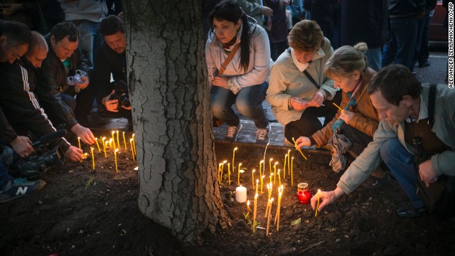 Pro-Russian protesters light candles in Donetsk on Saturday, May 3, to honor the memory of fallen comrades in Odessa.