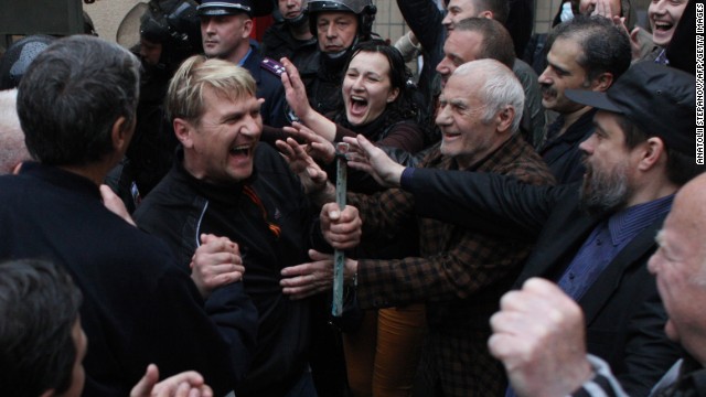 Pro-Russian militants who were arrested during a Ukrainian unity rally are greeted on Sunday, May 4, after being freed by police in Odessa. The men released Sunday had been detained after bloody clashes in Odessa, which ended in a deadly blaze. Forty-six people were killed in the bloodshed.