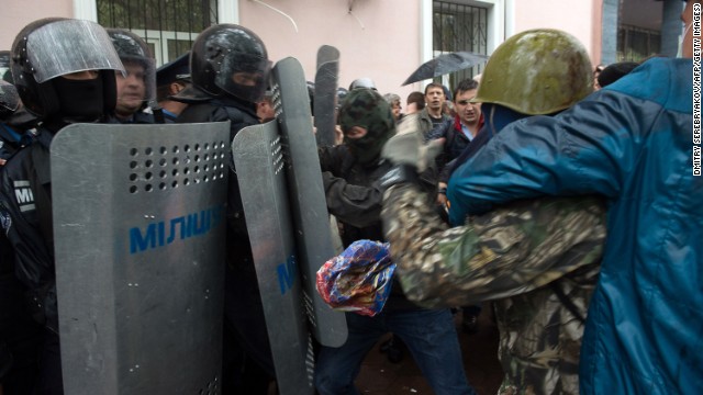 Pro-Russian militants clash with police as they storm the police station in Odessa on May 4.