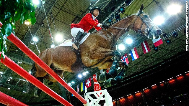 Beezie Madden of the U.S. and her horse Simon ride to glory at the FEI World Cup jumping final at the Gothenburg Horse Show in Sweden in April 2013.