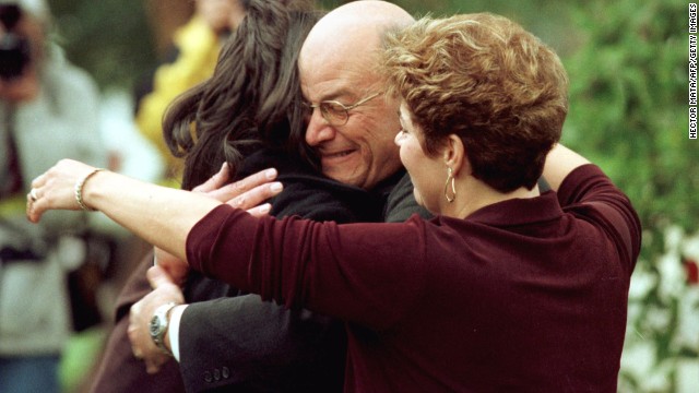 Lewinsky's father, Bernard, hugs her in front of his home in Brentwood, California, in 1998.