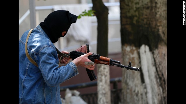 A pro-Russian gunman holds his weapon while guarding the local administration building in Slovyansk on May 6.