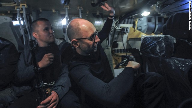 Ukrainian Prime Minister Arseniy Yatsenyuk, right, inspects an armored personnel carrier in Slovyansk on May 7.