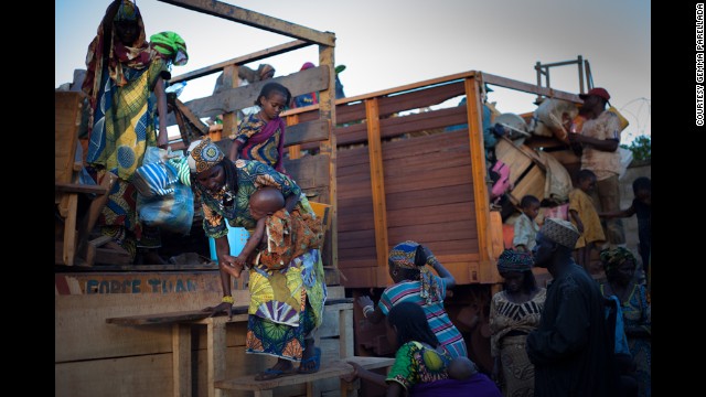 After a long day of traveling, refugees stop in Kaga Bandoro. The bodies of the two victims were buried nearby.