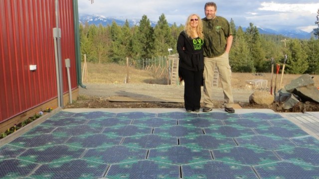 Solar Roadways co-founders Julie and Scott Brusaw stand on their prototype parking lot. Their idea calls for solar-powered roadways made of durable textured glass. 