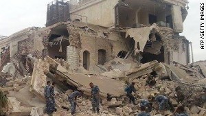 Syrian government forces sift through the rubble. 