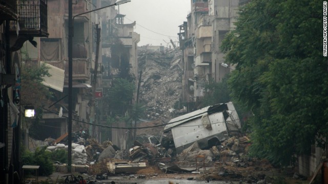 Debris lies on a deserted street in Homs on Thursday, May 8. 