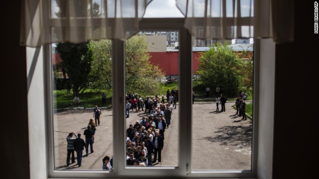 Ukrainians line up to cast their votes at a polling station in Donetsk on May 11.