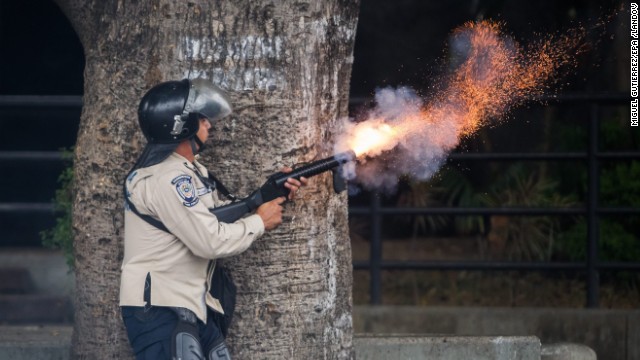 A member of the Bolivarian National Police clashes with protestors during a demonstration against Venezuelan President Nicolas Maduro in Caracas on Saturday, May 10. Clashes between anti-government protesters and security forces have left more than 40 people dead and about 800 injured since February, according to officials.