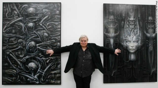 H.R. Giger poses with two of his works at the art museum in Chur, Switzerland, in 2007. 