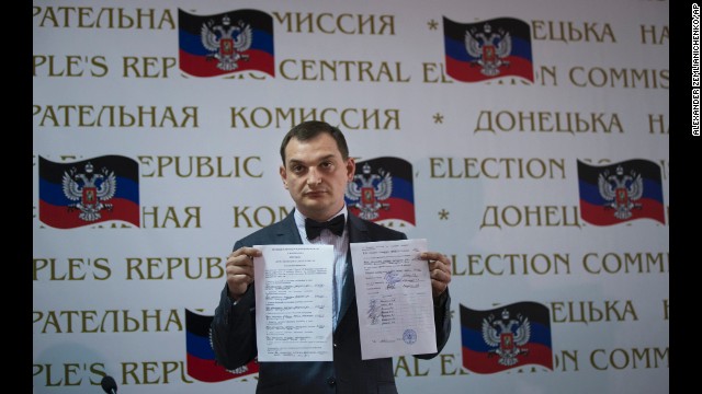 Roman Lyagin, a member of a rebel election commission, shows referendum results to journalists at a May 12 news conference in Donetsk. Pro-Russian separatists staged the referendum asking residents in the Donetsk and Luhansk regions whether they should declare independence from Ukraine. 