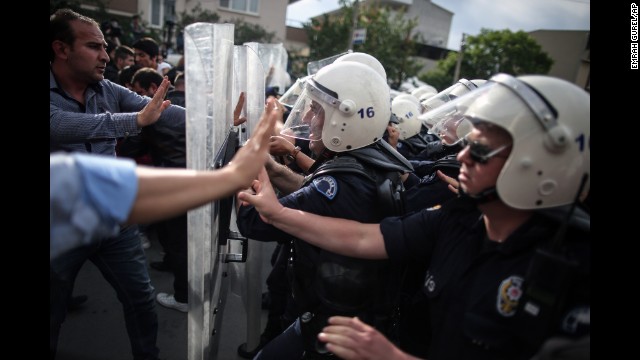 Riot police try to stop protesters attacking the offices of Erdogan's Justice and Development Party in Soma on May 14.