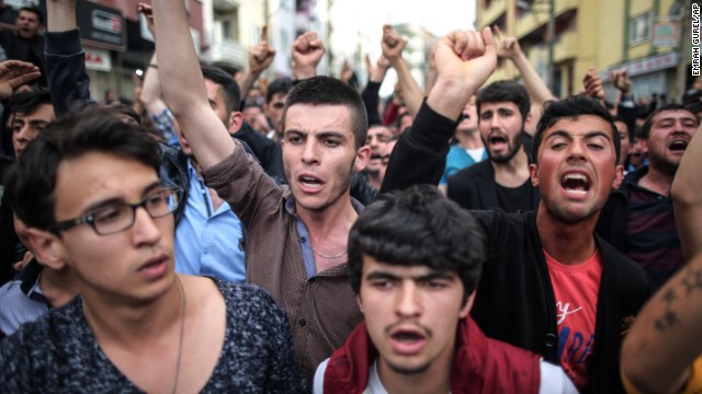 People march to the Soma offices of the Justice and Development Party.