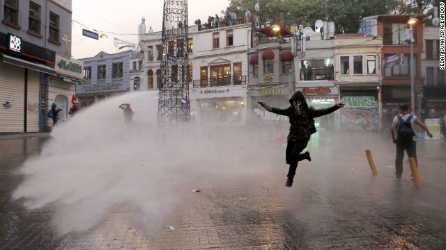 Riot police use a water cannon to disperse protesters in Istanbul. 