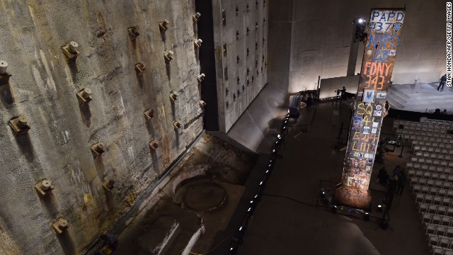 The symbolic "Last Column," right, a steel beam from one of the towers, stands near the "slurry wall," left, which holds back the Hudson River waters.