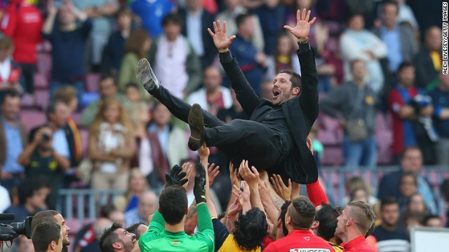 A jubilant Simeone was thrown in the air by his players following the 1-1 draw. 