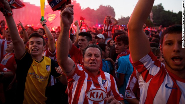 The worry and the waiting is over: Atletico fans celebrate in Madrid's Neptuno Square.