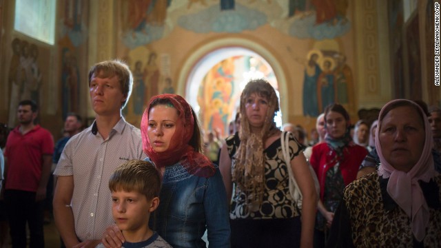 People pray for peace during an Orthodox church service in Slovyansk, eastern Ukraine, on Sunday, May 18. Tensions remain high across the country's east, where pro-Russia separatists staged a referendum on independence last weekend.