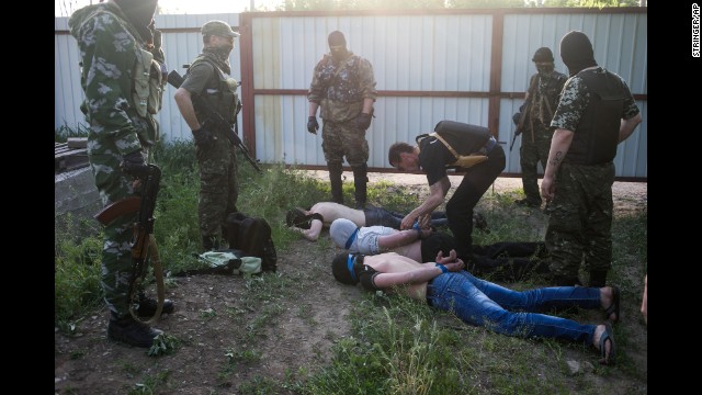 Pro-Russia militants detain three men on Sunday, May 18, in Kramatorsk, Ukraine, suspected of spying for the Ukrainian government.