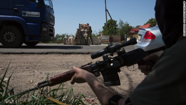 Pro-Russia militants guard a checkpoint outside Slovyansk on Saturday, May 17.