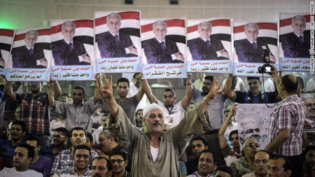 Supporters of Egyptian leftist presidential candidate Hamdeen Sabahi (portrait) attend a campaign meeting in Cairo.