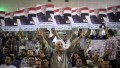 Supporters of Egyptian leftist presidential candidate Hamdeen Sabbahi (portrait) attend a campaign meeting in Cairo.