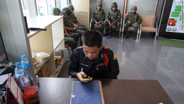 Soldiers sit in the lobby of the National Broadcasting Services of Thailand building on May 20.