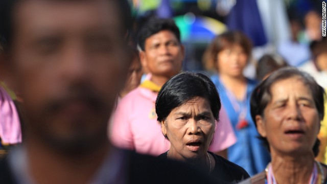 Anti-government protesters listen to their national anthem during a gathering in Bangkok on May 20.