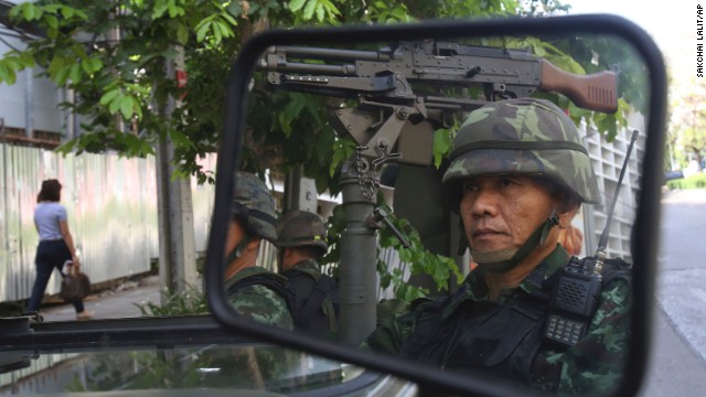 Thai soldiers guard the Thai police headquarters in Bangkok on Tuesday, May 20.