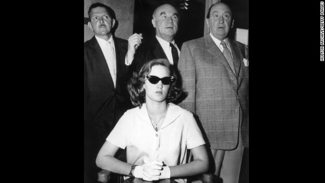 In 1958, a then 14-year-old Cheryl Crane, daughter of actress Lana Turner, stabbed her mother's boyfriend, Johnny Stompanato. Crane told police Stompanato, who had ties to organized crime, had threatened her mother with a knife. Here Crane is shown with three unidentified men at the time of her trial, which resulted in a ruling of justifiable homicide. 