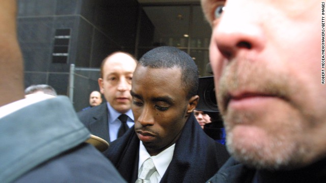 Sean Combs, then known as "Puffy," is flanked by security and court guards as he leaves the first day of his trial in January 2001 in New York City. The rapper/producer was charged in connection with a 1999 shooting in a New York City nightclub. He was found not guilty of all of the charges. 