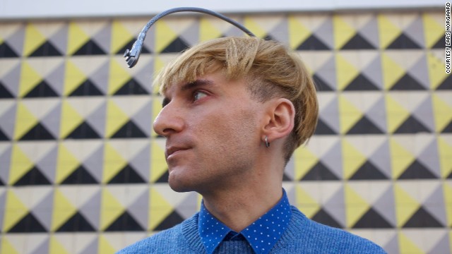 Neil Harbisson -- a contemporary artist born with color blindness -- has hacked a camera to pick up colors and transmit it to his ear as a musical note, via bone conduction. He calls it his <strong><a href='https://twitter.com/NeilHarbisson' target='_blank'>Eyeborg</a></strong><strong>.</strong>
