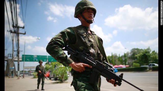 Thai soldiers patrol near a rally site for pro-government demonstrators on the outskirts of Bangkok on Thursday, May 22.