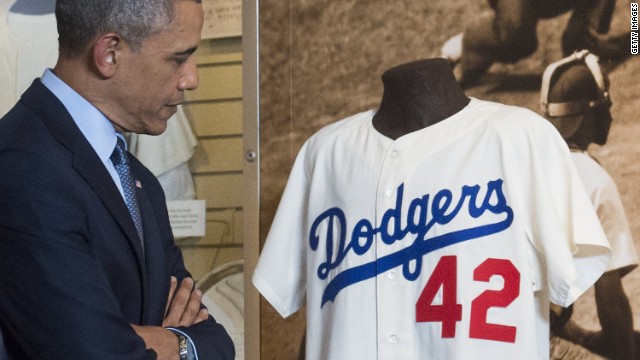 At baseball Hall, Obama holds 'Joltin Joe's' glove, talks tourism