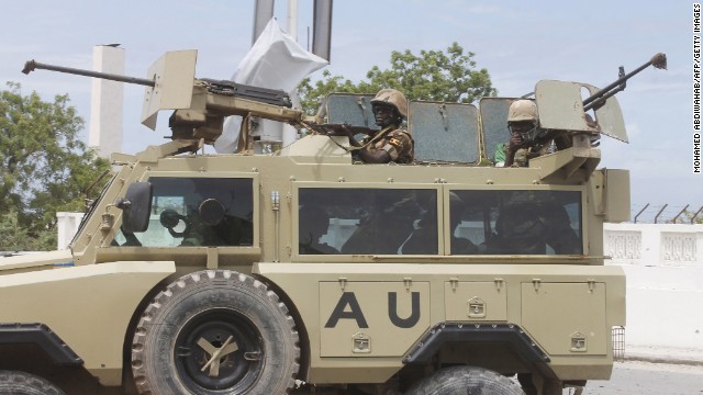 African Union troops arrive in an armored vehicle.