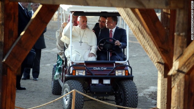 Pope Francis rides in a golf cart with King Abdullah II of Jordan on May 24 as they visit Bethany, on the eastern bank of the Jordan River.
